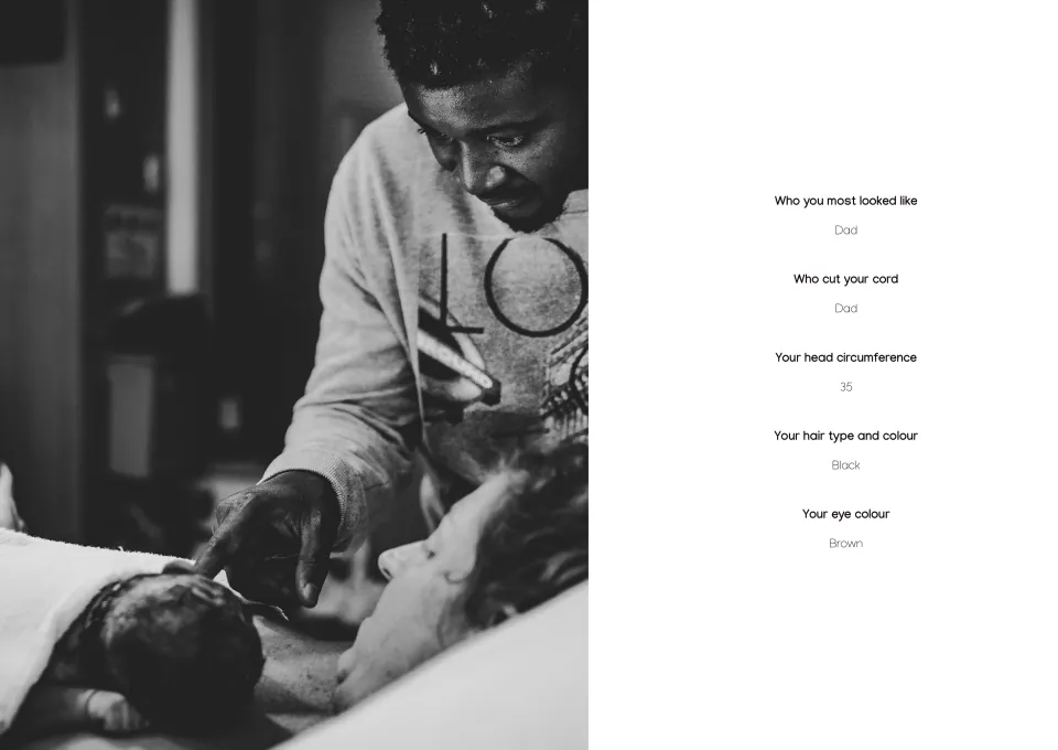 The About You page from the Earthside chapter of a First Year Journal: a black-and-white photo of a father leaning over the mother as she holds their newborn in hospital, beside answers about who the baby most looked like, who cut the cord, head circumference, hair and eye colour