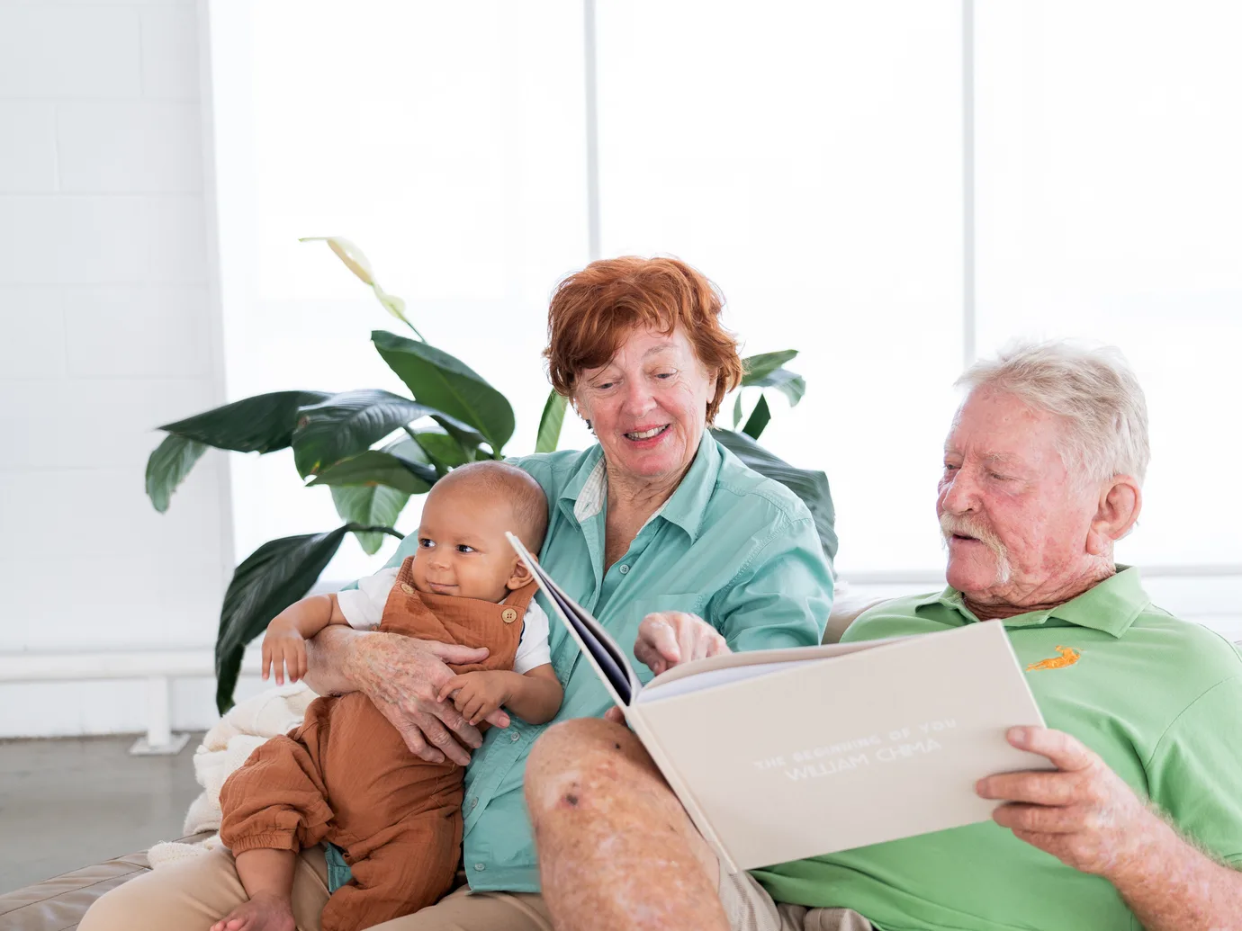 Grandparents meeting their grandchild's story for the first time.